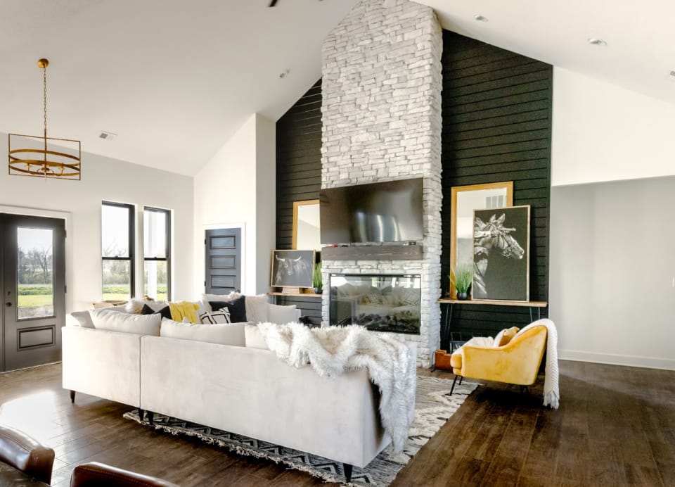 Modern living room with stone fireplace and decor.. franklin, miami, johnson county. Paola, Olathe, Louisburg Kansas. Custom Home in