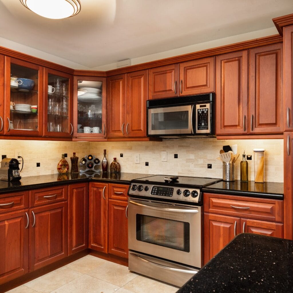 Modern kitchen with wooden cabinets and appliances.