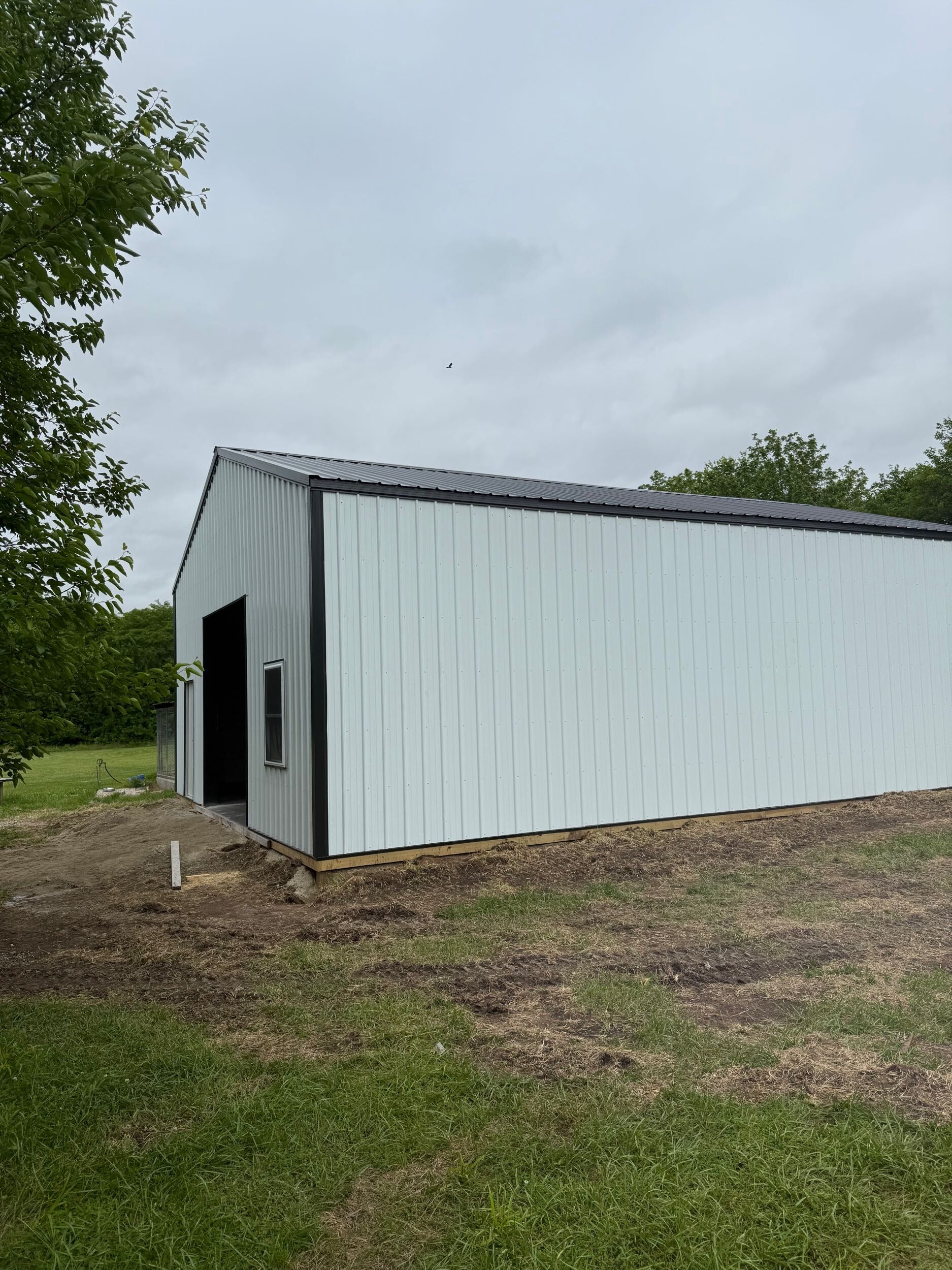 White metal building on a cloudy day
